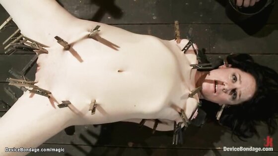 Bound slave in metal body clamped