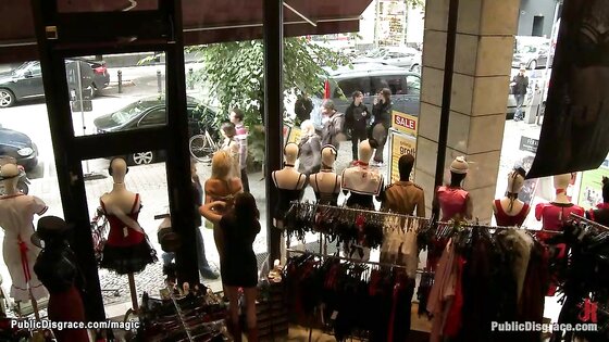 Naked blonde bound in shop window