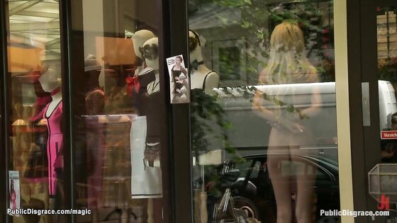 Naked blonde bound in shop window