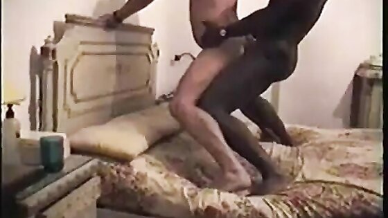 Interracial fuck standing on the bed