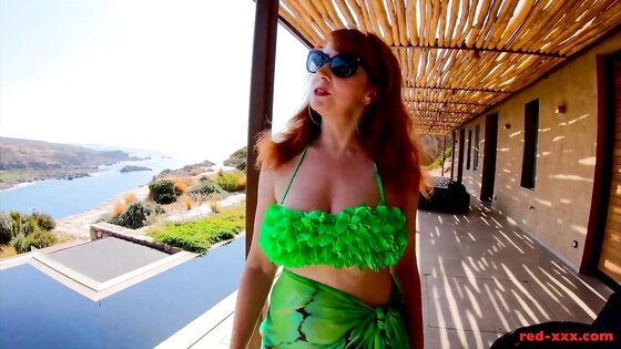 Busty redhead MILF Red XXX gets off poolside