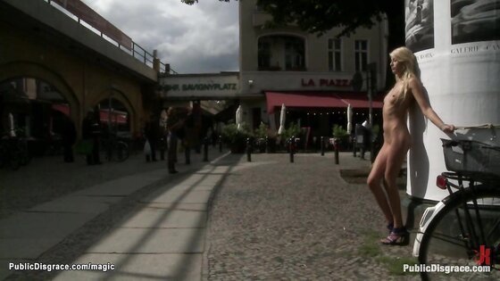 Naked slave bound in the city center