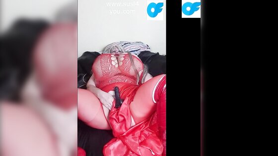 Susi is wearing a red fishnet suit fucking pussy with bbc toy