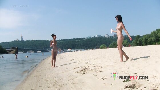 Bombastic young nudist babes sunbathe nude at the beach