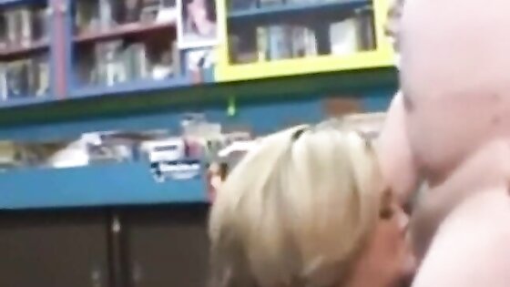 Woman randomly sucks a dirty video store clerk