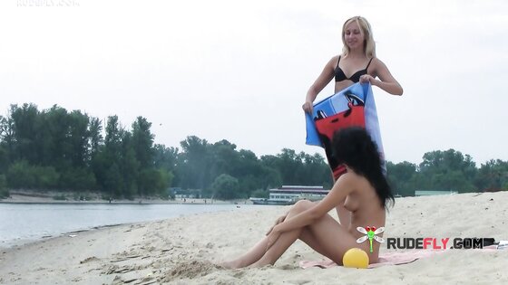 Ravishing nude beach girl caught on a hidden camera sunbathing outdoors