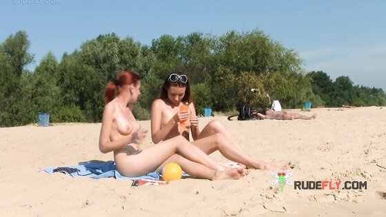 Petite nudist teen enjoys a beautiful day at the beach