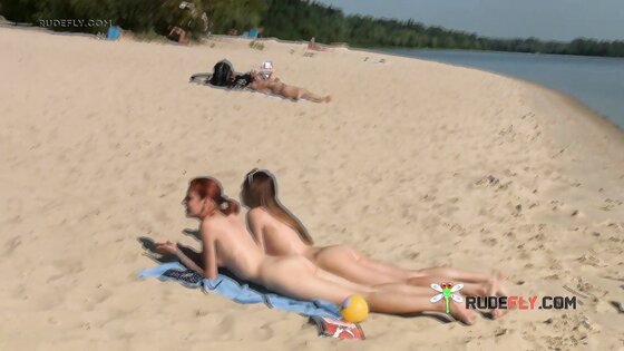 Petite nudist teen enjoys a beautiful day at the beach