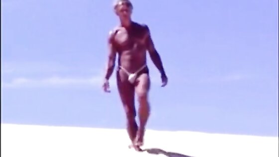 Tanned guy on beach in tiny string thong (temporarily!)