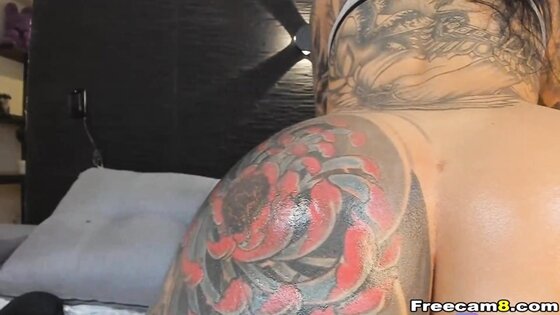 Tattooed Cougar With An Amazing Round Ass