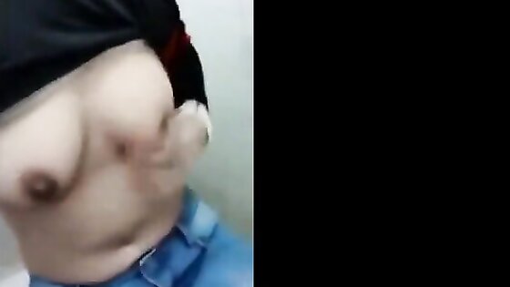 hot tudung slut rubbing her pussy in toilet