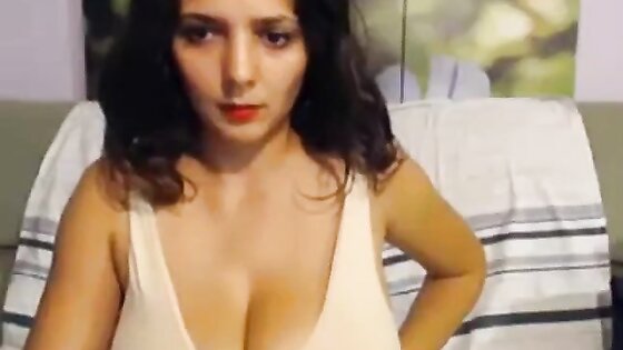 Brunette posing her huge big tits