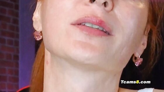 Redhead shemale jerking her shaved cock