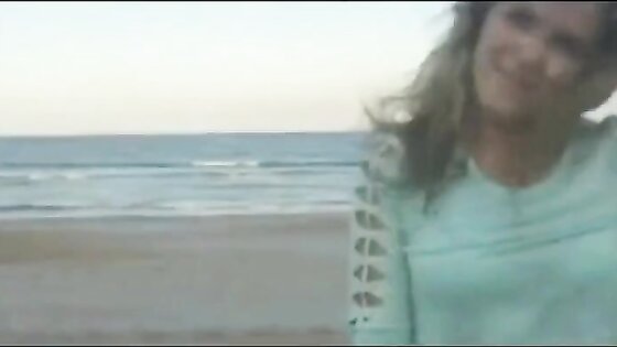 Girl lets her lover cum over her face at the beach