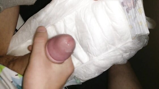 Twink cumming his wet diaper