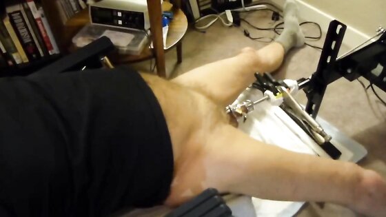 Fuck machine sounding my cock in chastity cage
