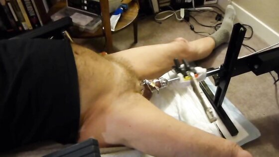 Fuck machine sounding my cock in chastity cage