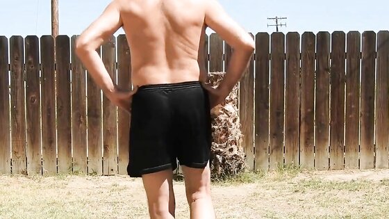 A daddy parading around naked in his backyard.