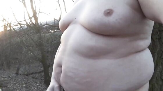 Chubby masturbates in the woods