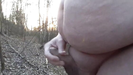 Chubby masturbates in the woods