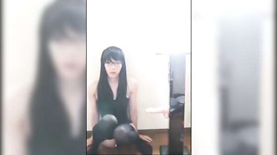 Cute Asian crossdresser cums on rubber cock