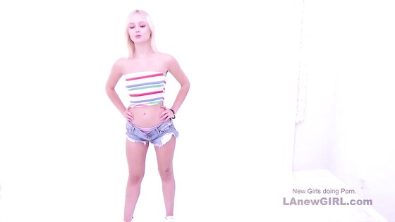 Blonde Teen model takes cock deep throat in studio