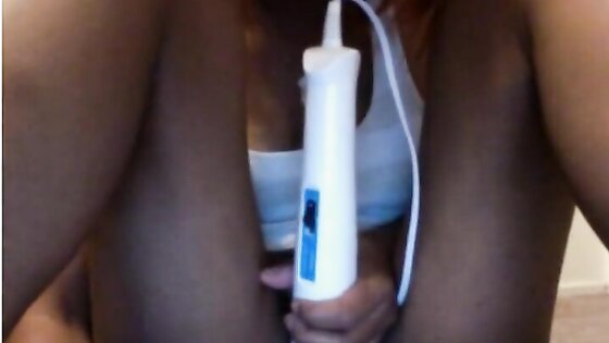 Vibrator on ebony pussy