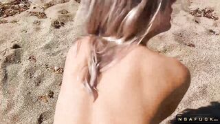 Cutie takes a cum load on her belly after sex on a beach
