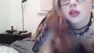 Naughty Chick with glasses masturbating and loving it