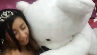 Naughty Latina playing with stuffed animal